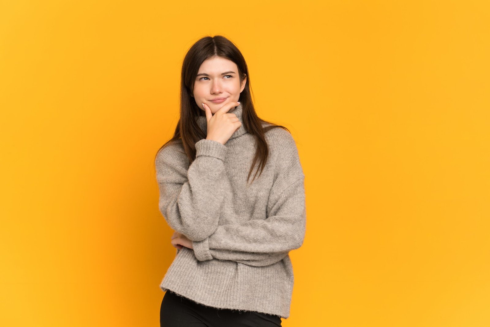 young,ukrainian,girl,isolated,on,yellow,background,thinking,an,idea